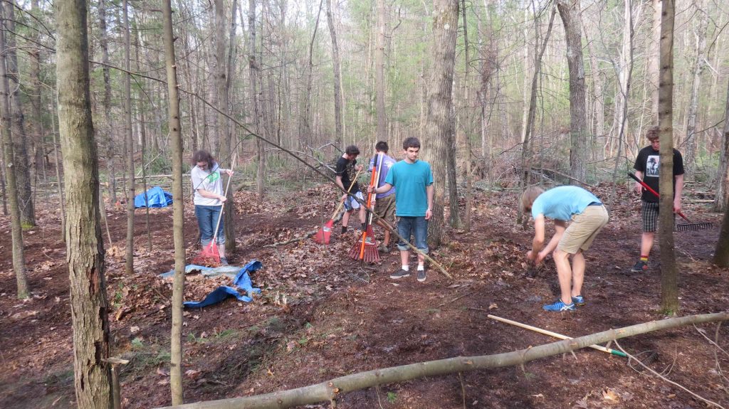 Students make progress on mimicking the effects of fire on the forest floor. 